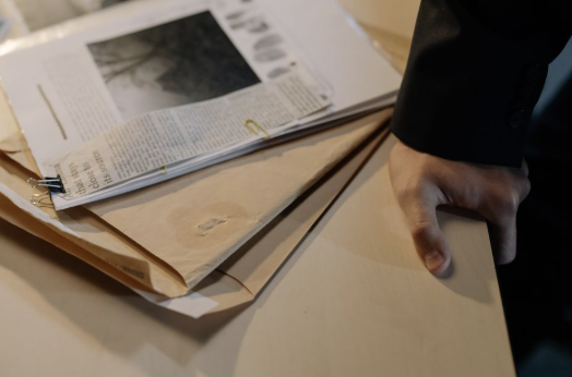 An attorney reviewing a confidentiality agreement before delegating work