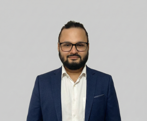 Gloov Outsourcing leadership team member wearing a navy blazer